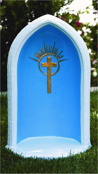 a unique grotto this pointed arch with a cast inlay cross